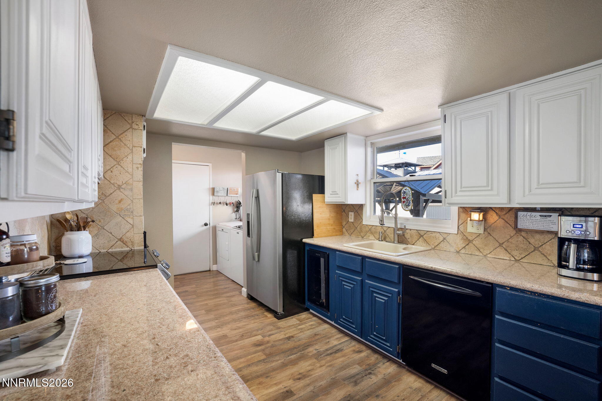 99 Toll Road Virginia City, NV 89440 - Photo 18 of 44 a kitchen with granite countertop a sink stainless steel appliances and cabinets