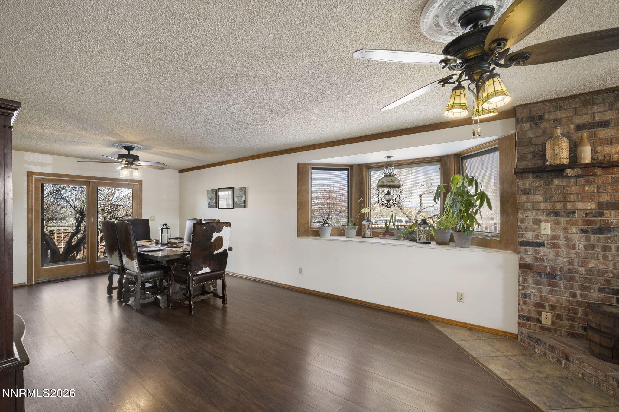 99 Toll Road Virginia City, NV 89440 - Photo 23 of 44 a view of a dining room with furniture window and wooden floor