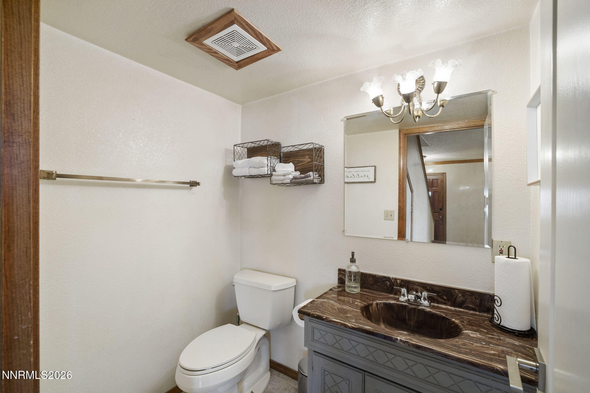 99 Toll Road Virginia City, NV 89440 - Photo 26 of 44 a bathroom with a sink a toilet a mirror and shower