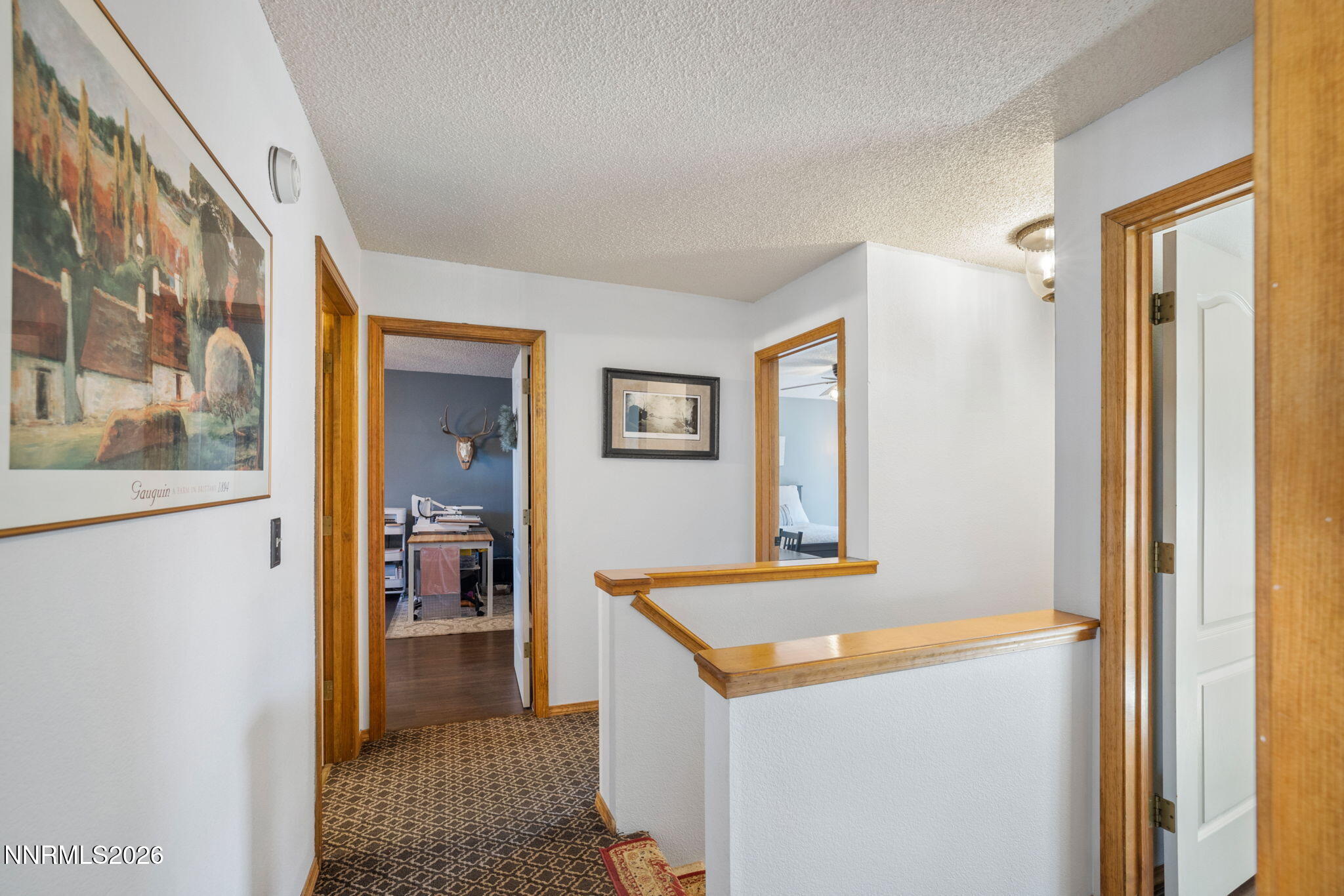 99 Toll Road Virginia City, NV 89440 - Photo 28 of 44 a view of a hallway with bathroom and wooden floor