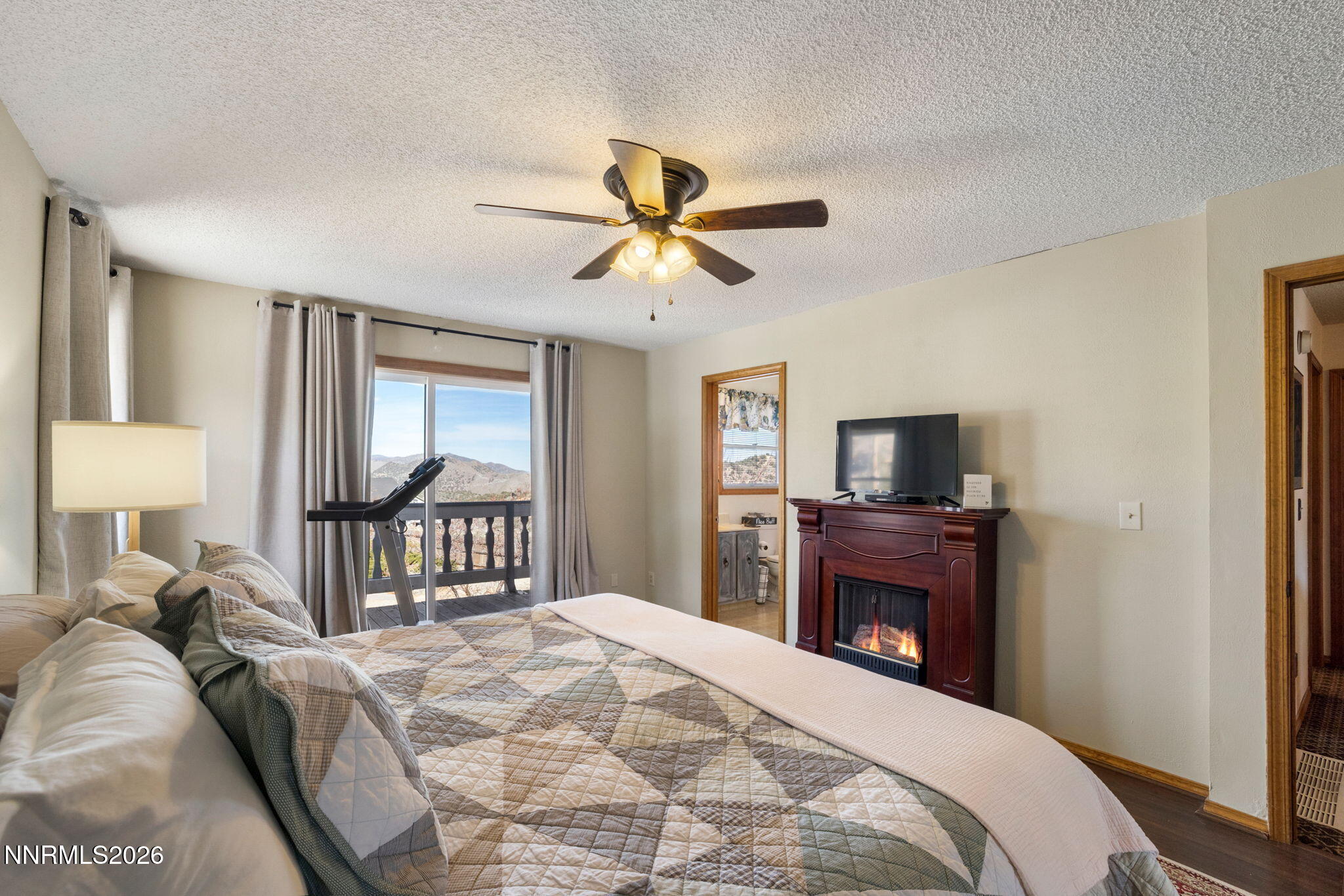 99 Toll Road Virginia City, NV 89440 - Photo 29 of 44 a bedroom with a bed and a tv