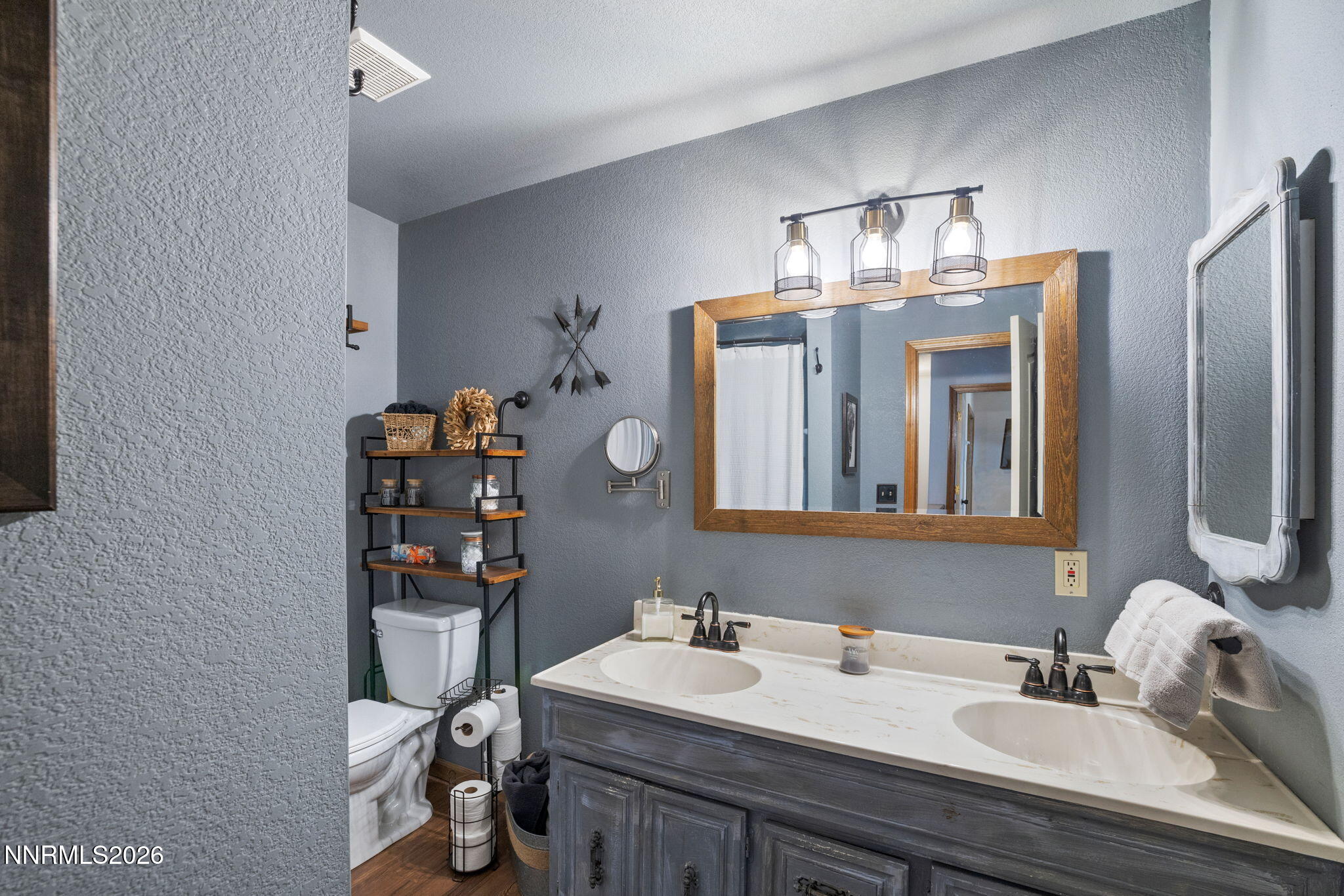 99 Toll Road Virginia City, NV 89440 - Photo 31 of 44 a bathroom with a sink double vanity and mirror