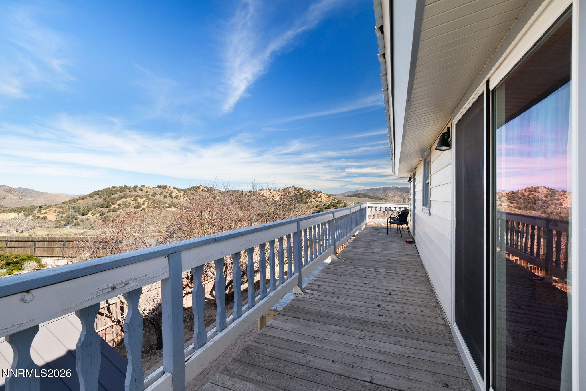 99 Toll Road Virginia City, NV 89440 - Photo 33 of 44 a view of a balcony with wooden floor and fence