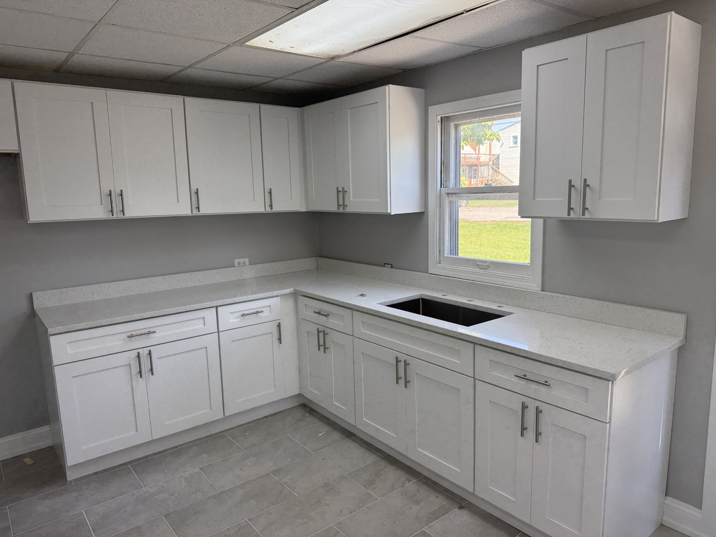 17 West 30th Place Steger, IL 60475 - Photo 4 of 15 a kitchen with white cabinets and white appliances