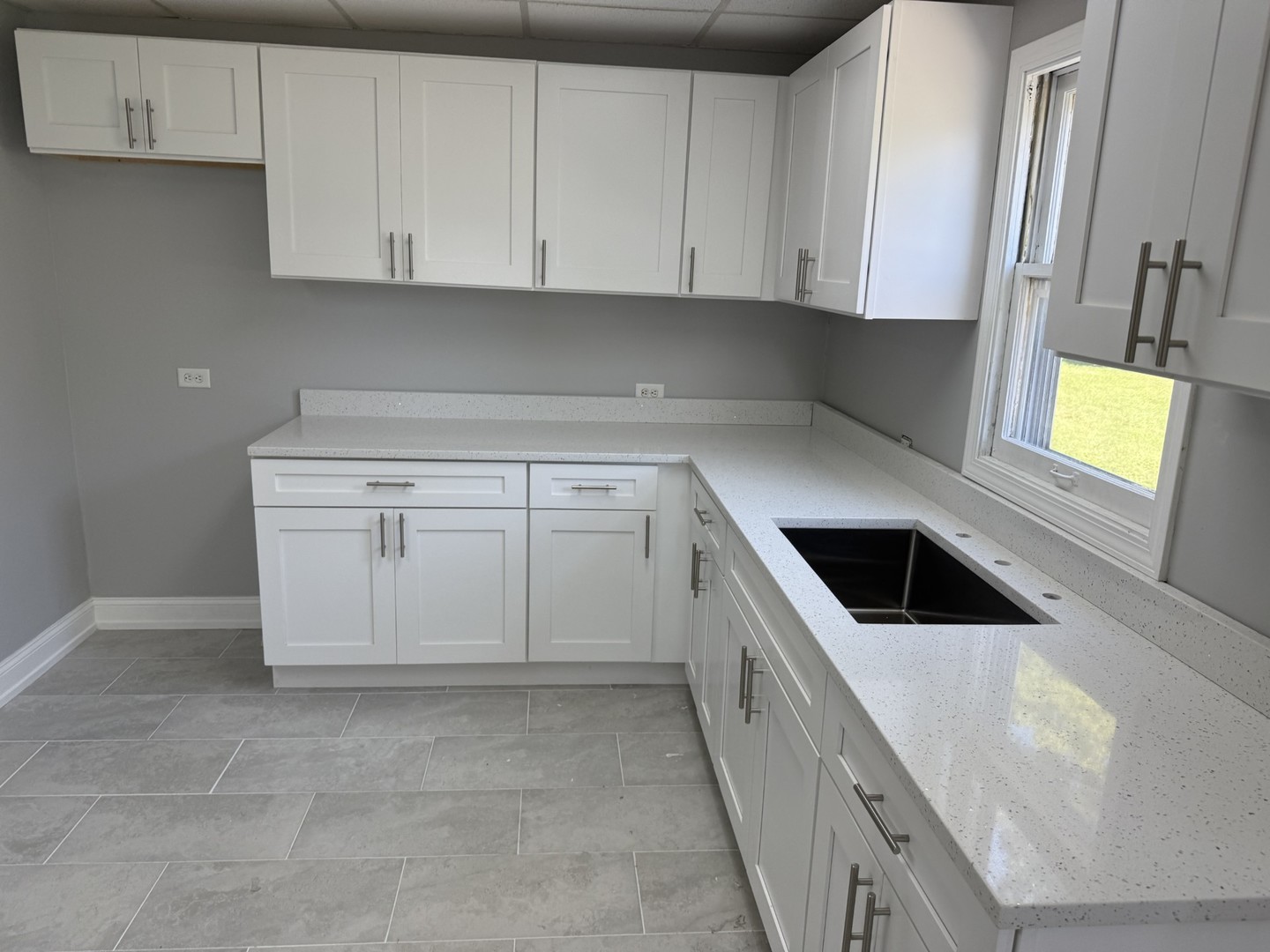 17 West 30th Place Steger, IL 60475 - Photo 7 of 15 a kitchen with white cabinets and white appliances