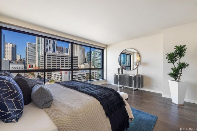 a bed room with a bed and a lamp