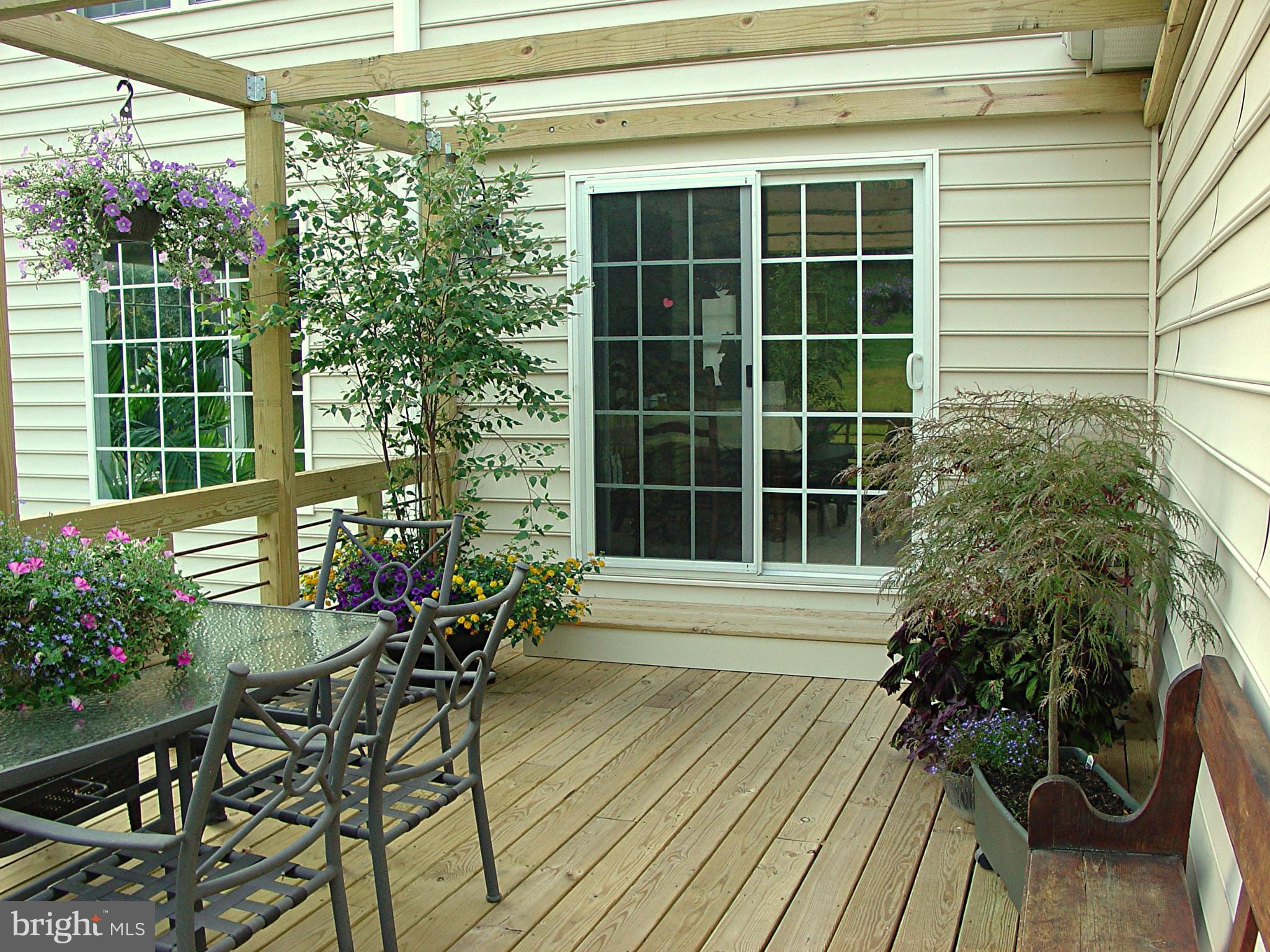 2705 Garrett Road White Hall, MD 21161 - Photo 17 of 30 a view of a house with a porch and bench