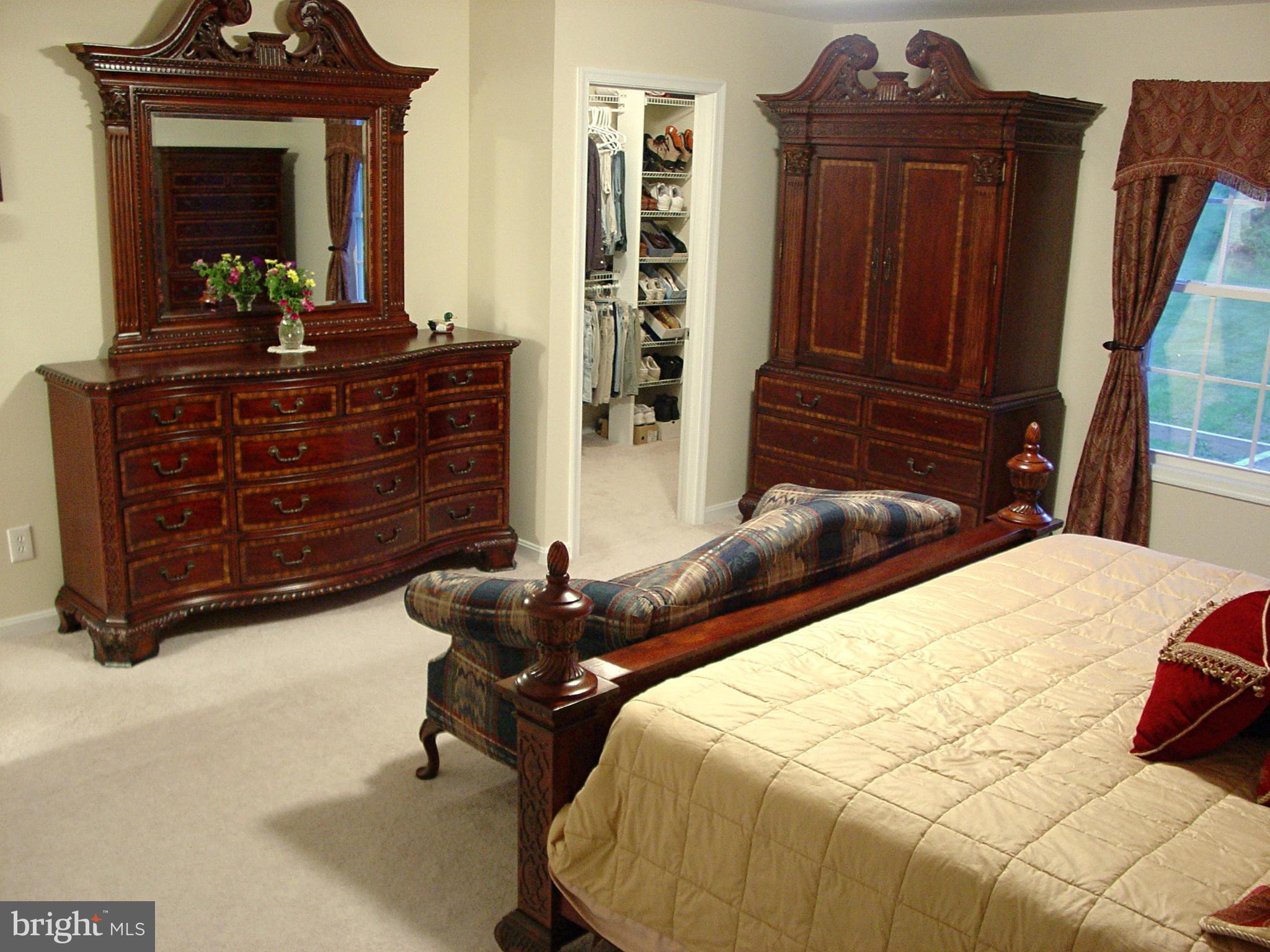 2705 Garrett Road White Hall, MD 21161 - Photo 26 of 30 a bedroom with a bed and wooden floor