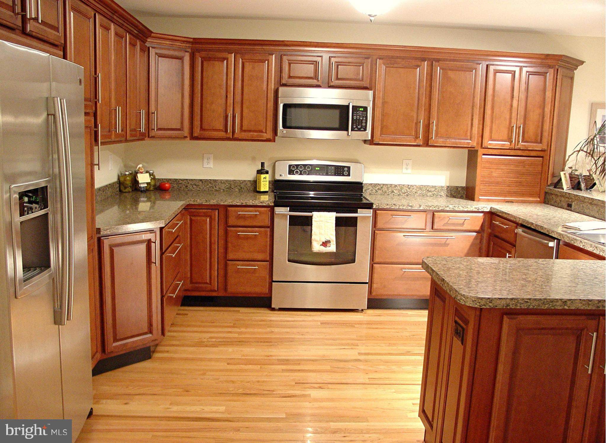 2705 Garrett Road White Hall, MD 21161 - Photo 5 of 30 a kitchen with stainless steel appliances granite countertop a refrigerator a stove a sink and a microwave