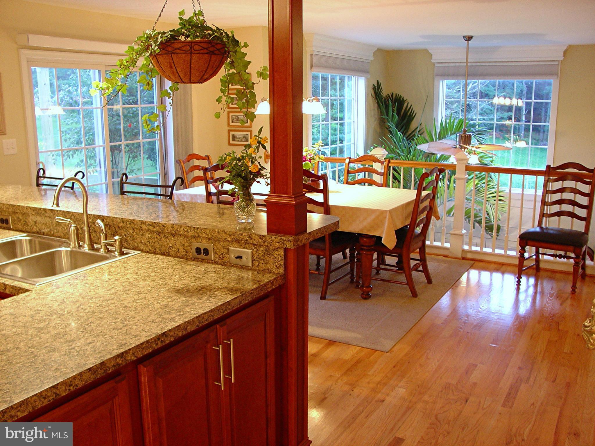 2705 Garrett Road White Hall, MD 21161 - Photo 6 of 30 a dining room with furniture wooden floor and a chandelier