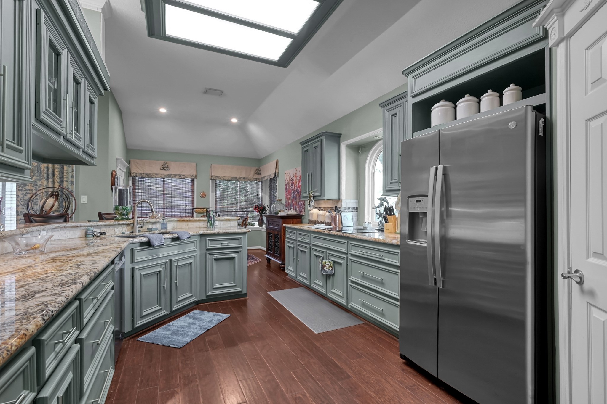 192 Monterrey Road West Montgomery, TX 77356 - Photo 15 of 45 a kitchen with stainless steel appliances granite countertop a refrigerator a stove and a sink