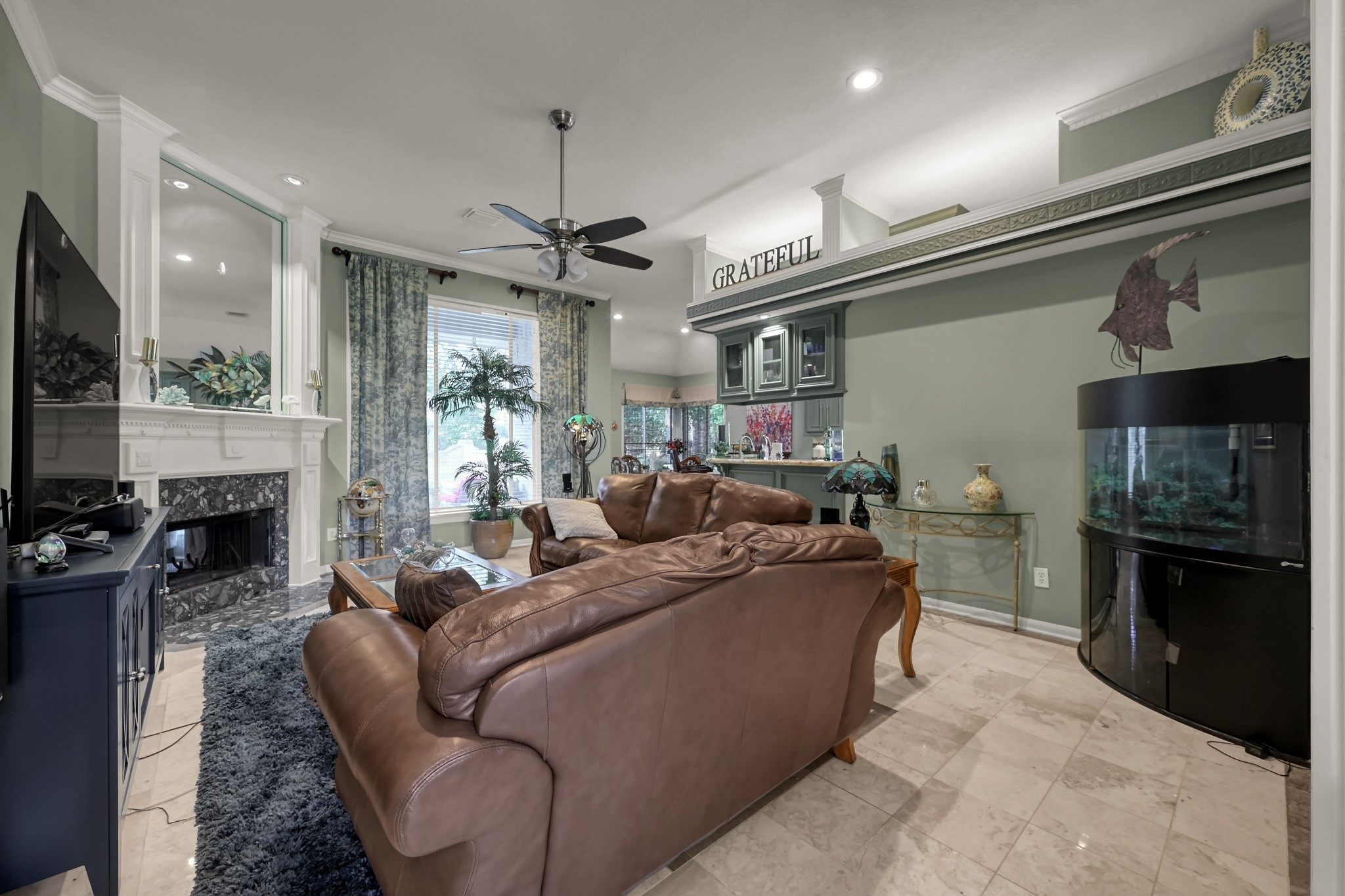 192 Monterrey Road West Montgomery, TX 77356 - Photo 10 of 45 a living room with furniture a fireplace and a flat screen tv
