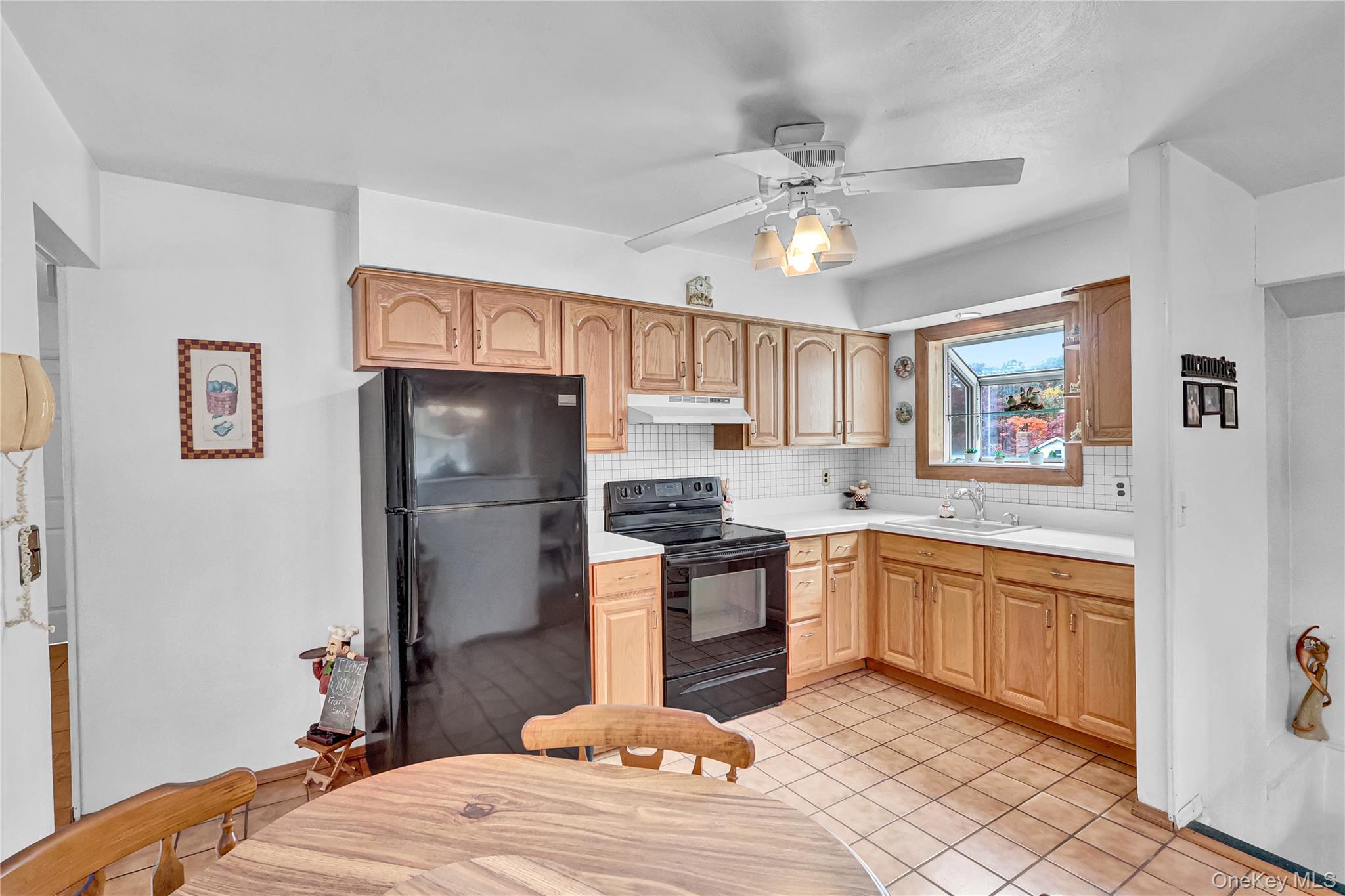 70 Blue Point Road Selden, NY 11784 - Photo 12 of 27 a kitchen with stainless steel appliances granite countertop a refrigerator and a stove top oven