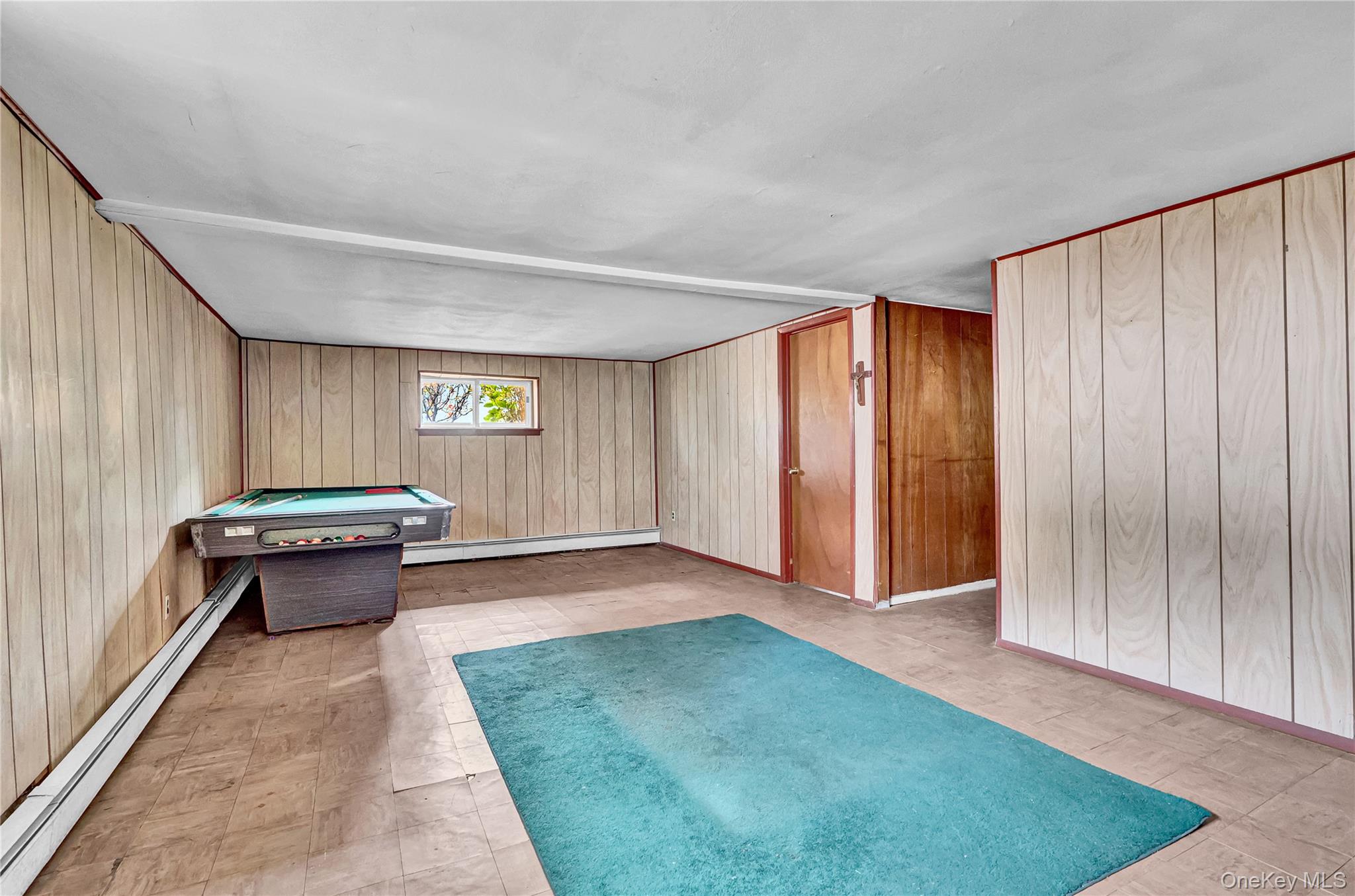 70 Blue Point Road Selden, NY 11784 - Photo 19 of 27 a view of a room with window and couch