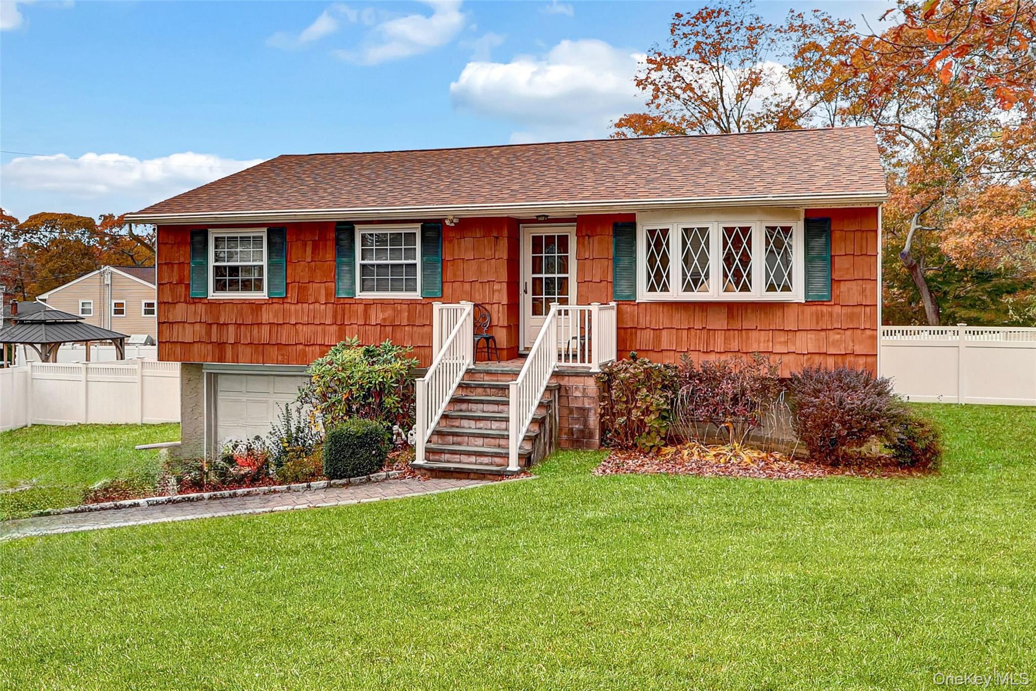 70 Blue Point Road Selden, NY 11784 - Photo 26 of 27 front view of a house with a yard
