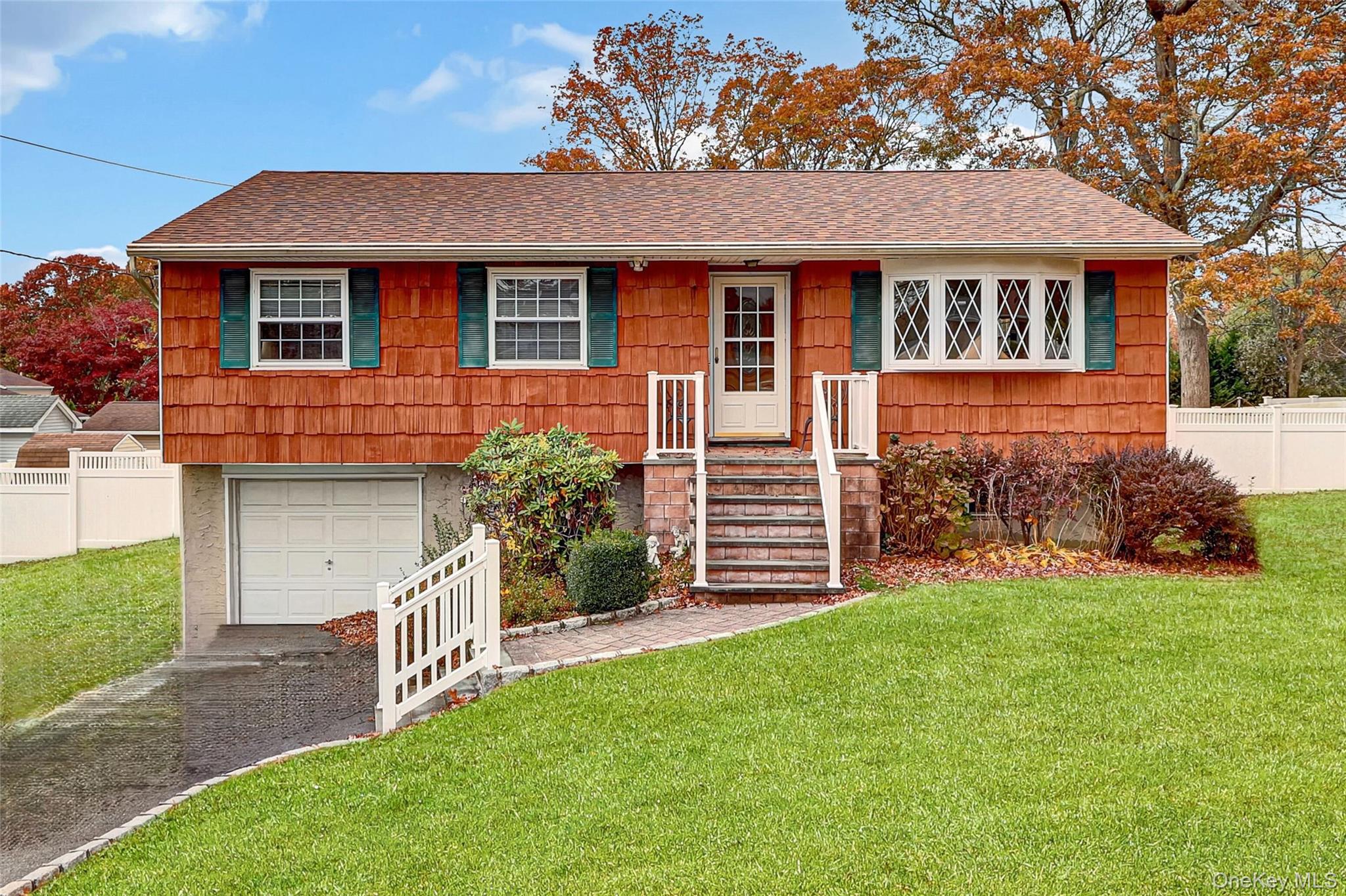 70 Blue Point Road Selden, NY 11784 - Photo 27 of 27 a front view of a house with a yard