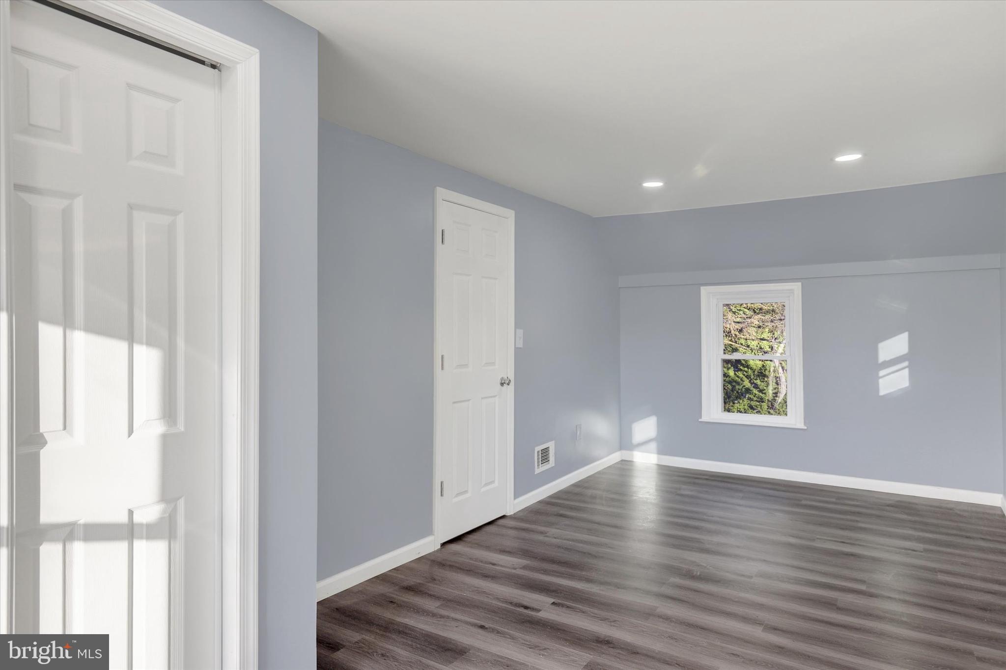 2449 Hafer Road Fayetteville, PA 17222 - Photo 21 of 34 a view of an empty room with wooden floor and a window