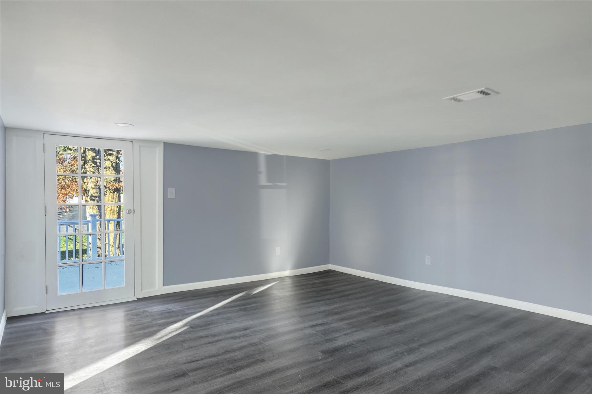 2449 Hafer Road Fayetteville, PA 17222 - Photo 22 of 34 a view of an empty room with wooden floor and a window