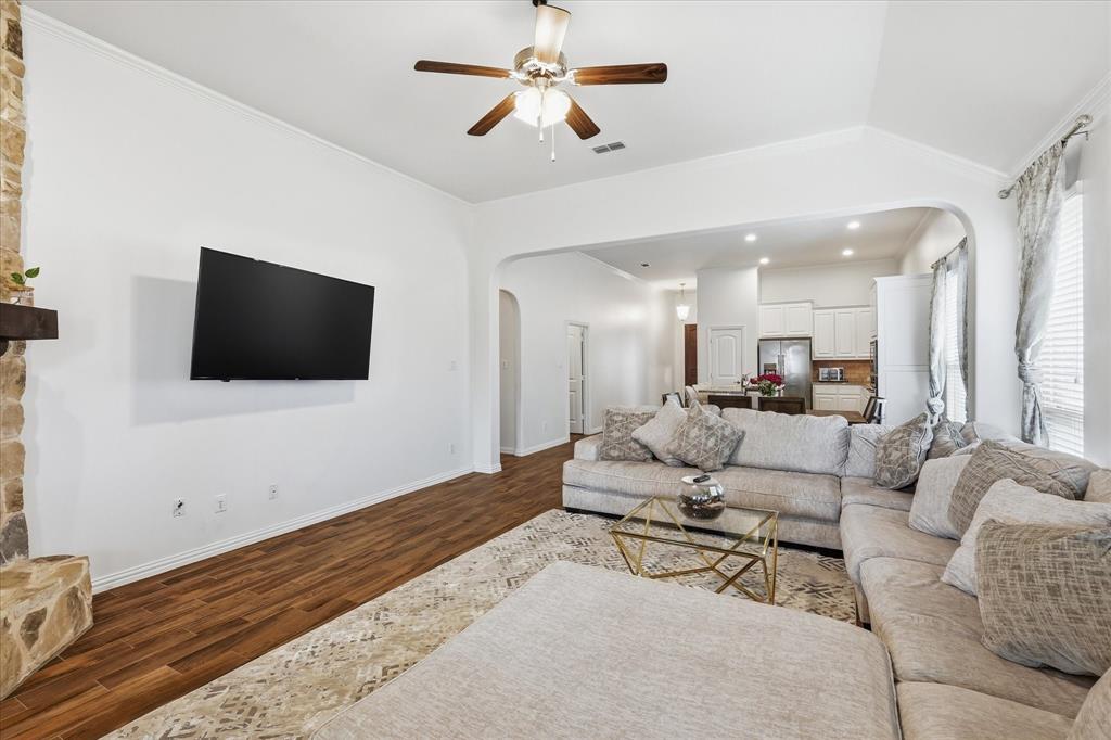 215 Equestrian Road Hickory Creek, TX 75065 - Photo 18 of 36 a living room with furniture and a flat screen tv
