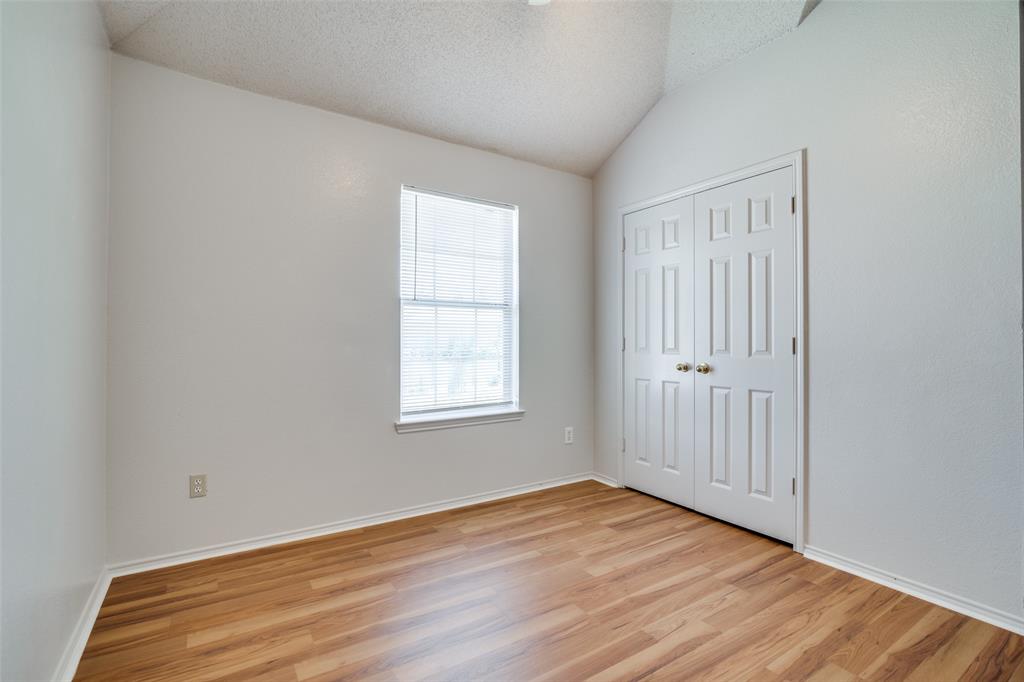 2401 Redfield Drive Mesquite, TX 75181 - Photo 20 of 25 an empty room with wooden floor and windows