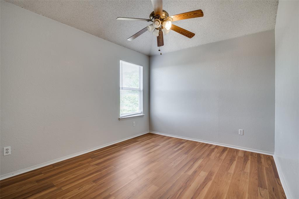 2401 Redfield Drive Mesquite, TX 75181 - Photo 22 of 25 wooden floor in an empty room with a window