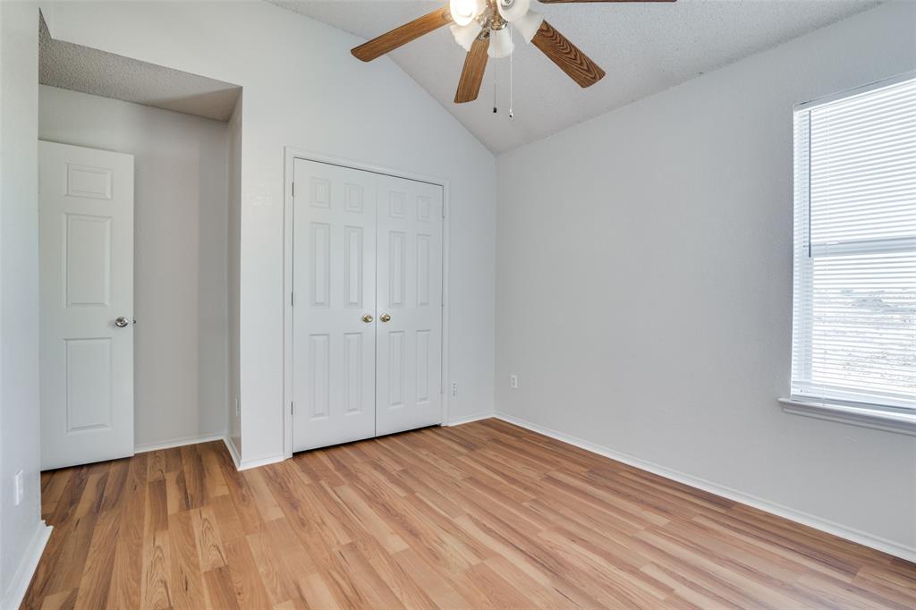 2401 Redfield Drive Mesquite, TX 75181 - Photo 23 of 25 a view of empty room with wooden floor and fan