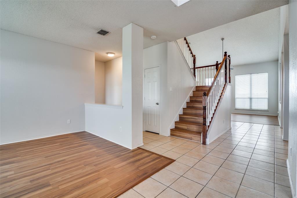 2401 Redfield Drive Mesquite, TX 75181 - Photo 3 of 25 a view of entryway and hall with wooden floor