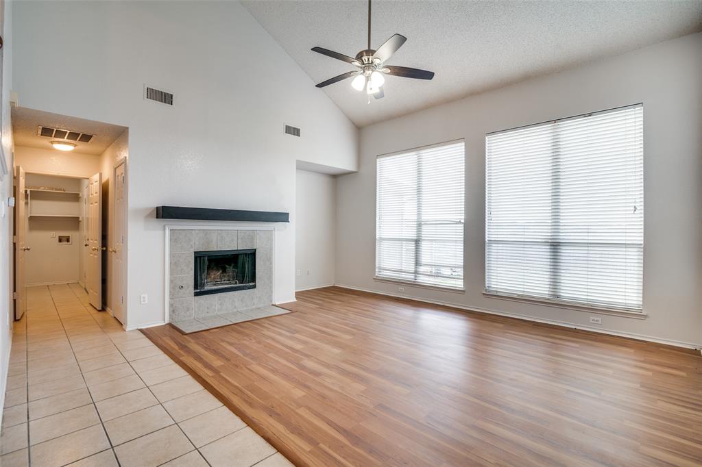 2401 Redfield Drive Mesquite, TX 75181 - Photo 4 of 25 a view of empty room with wooden floor and fireplace