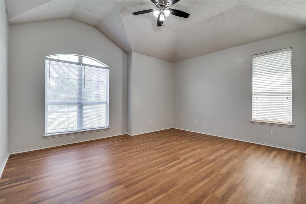 2401 Redfield Drive Mesquite, TX 75181 - Photo 9 of 25 a view of an empty room with wooden floor and a window
