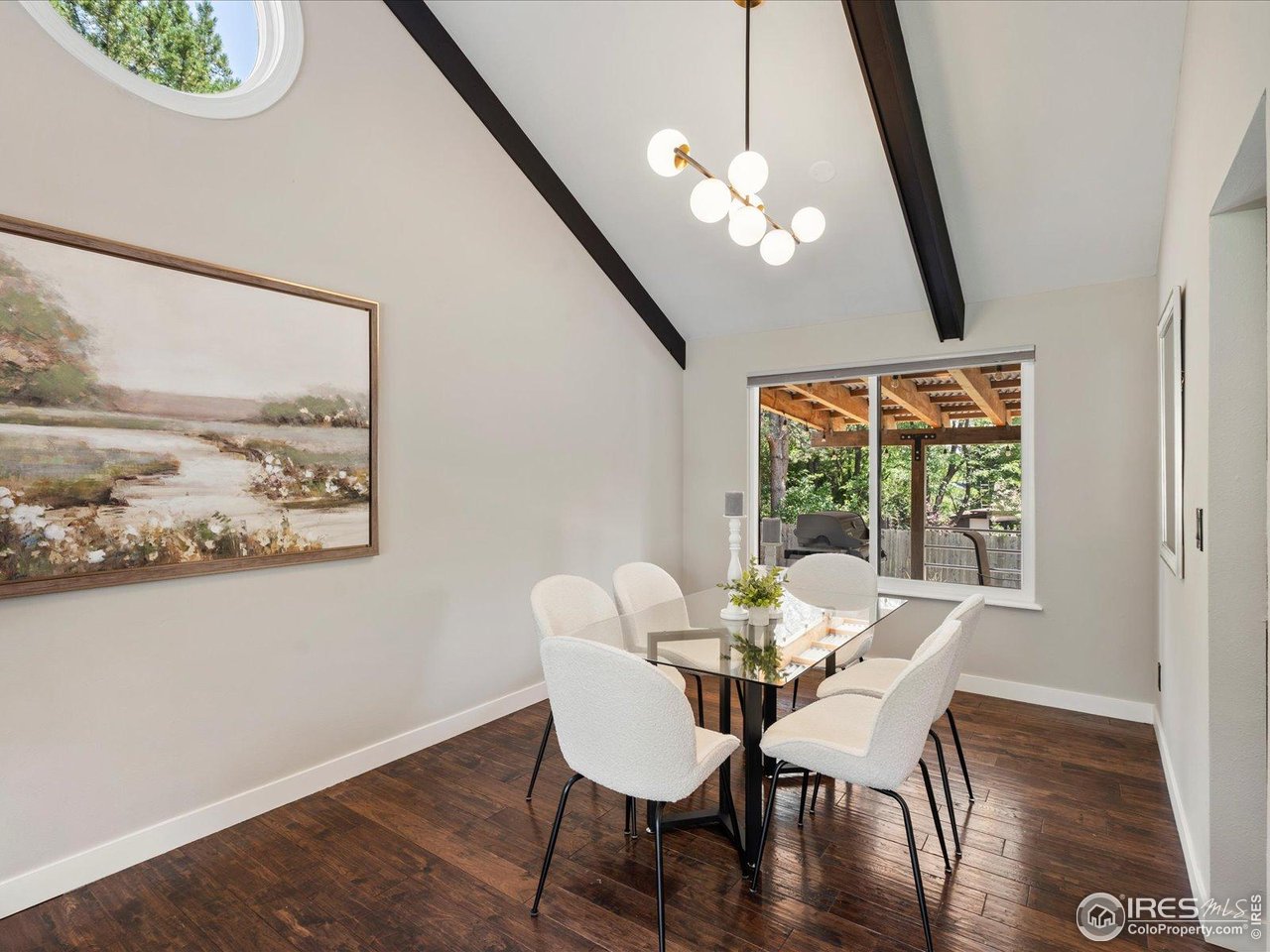7466 Old Post Road Boulder, CO 80301 - Photo 11 of 36 a view of a dining room with furniture and wooden floor