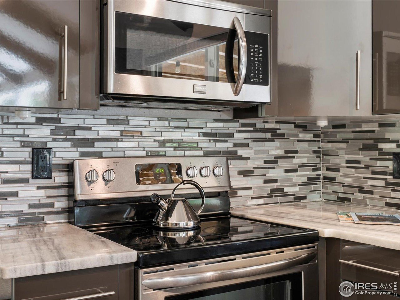 7466 Old Post Road Boulder, CO 80301 - Photo 15 of 36 a stove top oven sitting inside of a kitchen