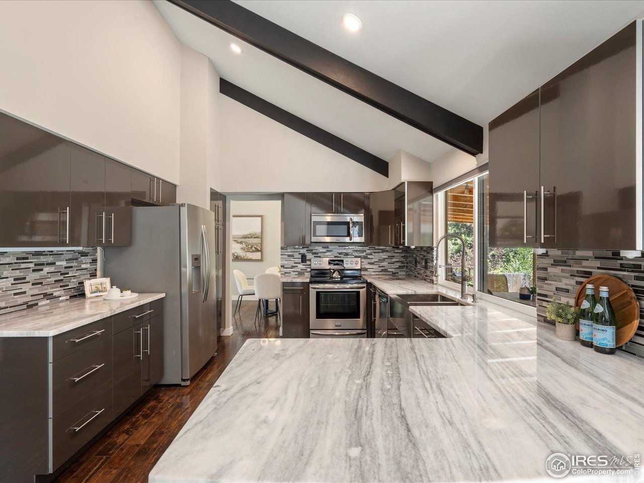7466 Old Post Road Boulder, CO 80301 - Photo 16 of 36 a kitchen with stainless steel appliances granite countertop lots of counter top space