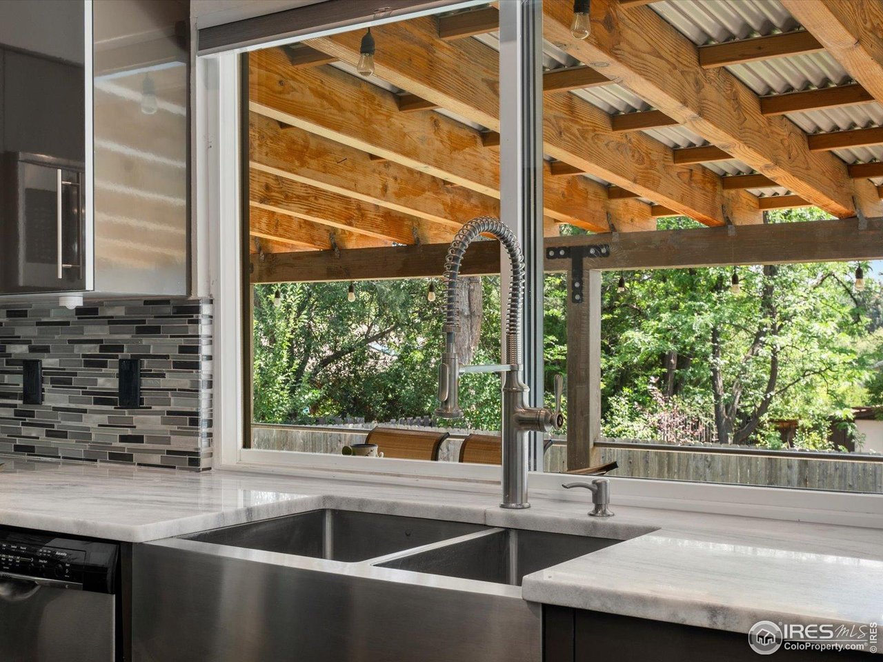7466 Old Post Road Boulder, CO 80301 - Photo 17 of 36 a kitchen with a sink and large window