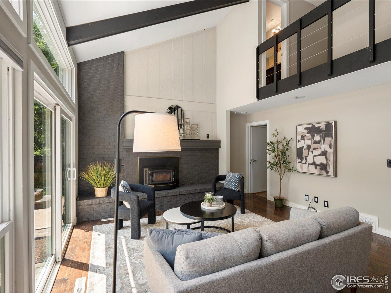7466 Old Post Road Boulder, CO 80301 - Photo 19 of 36 a living room with furniture and a fireplace