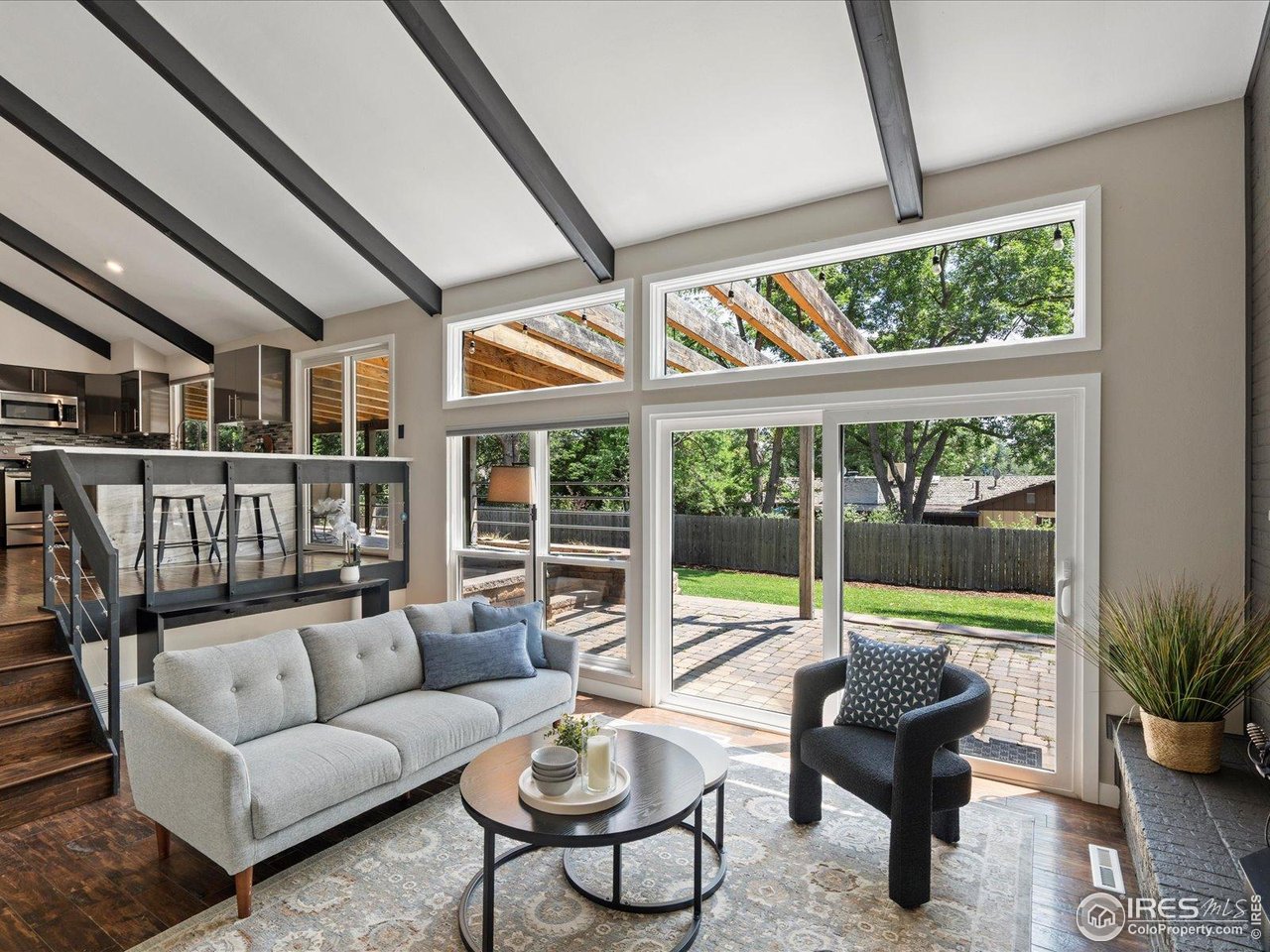 7466 Old Post Road Boulder, CO 80301 - Photo 20 of 36 a balcony with furniture and wooden floor