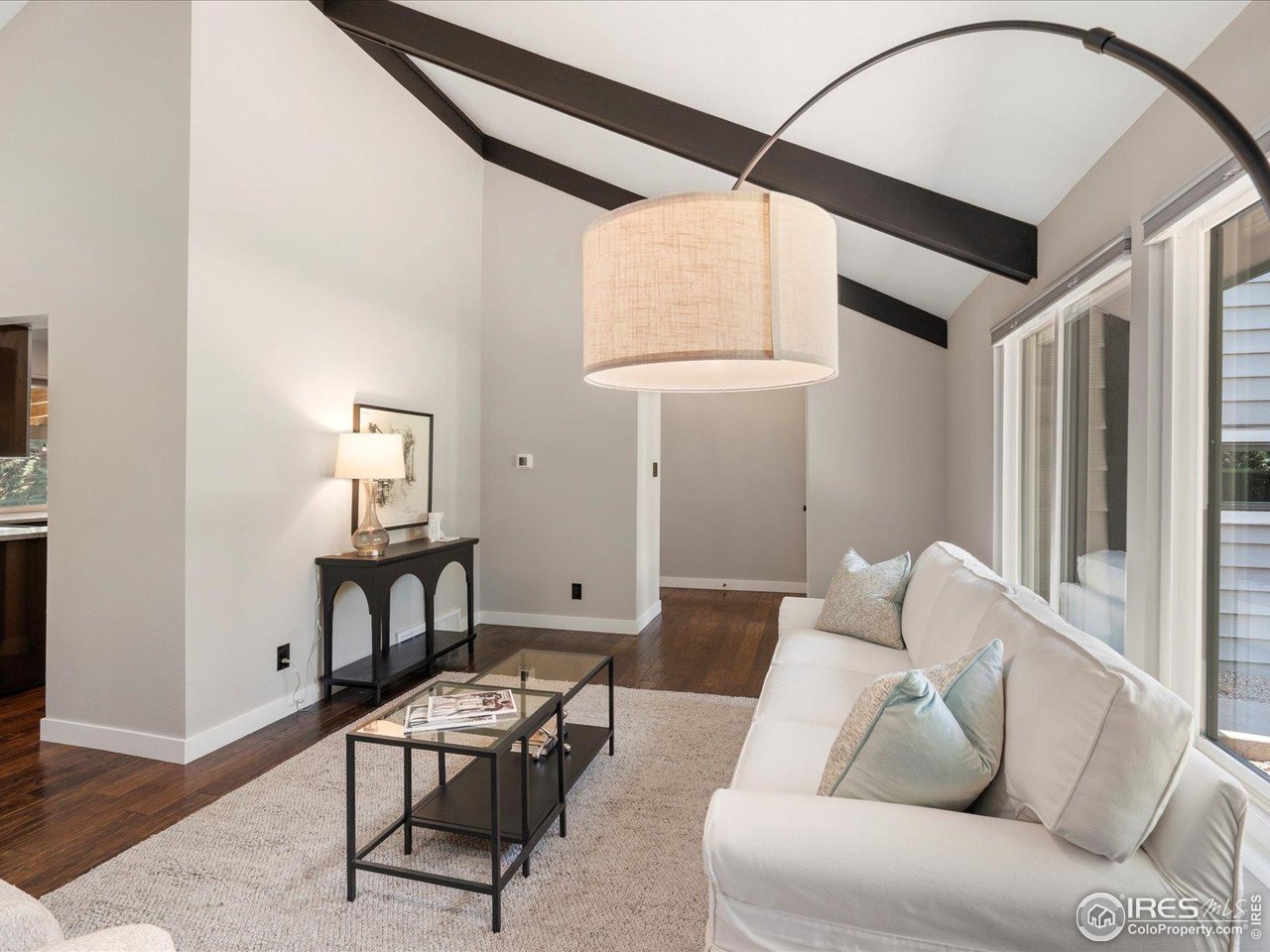 7466 Old Post Road Boulder, CO 80301 - Photo 9 of 36 a living room with furniture and a window