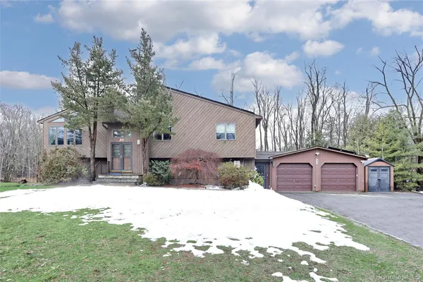 a house view with a covered with snow