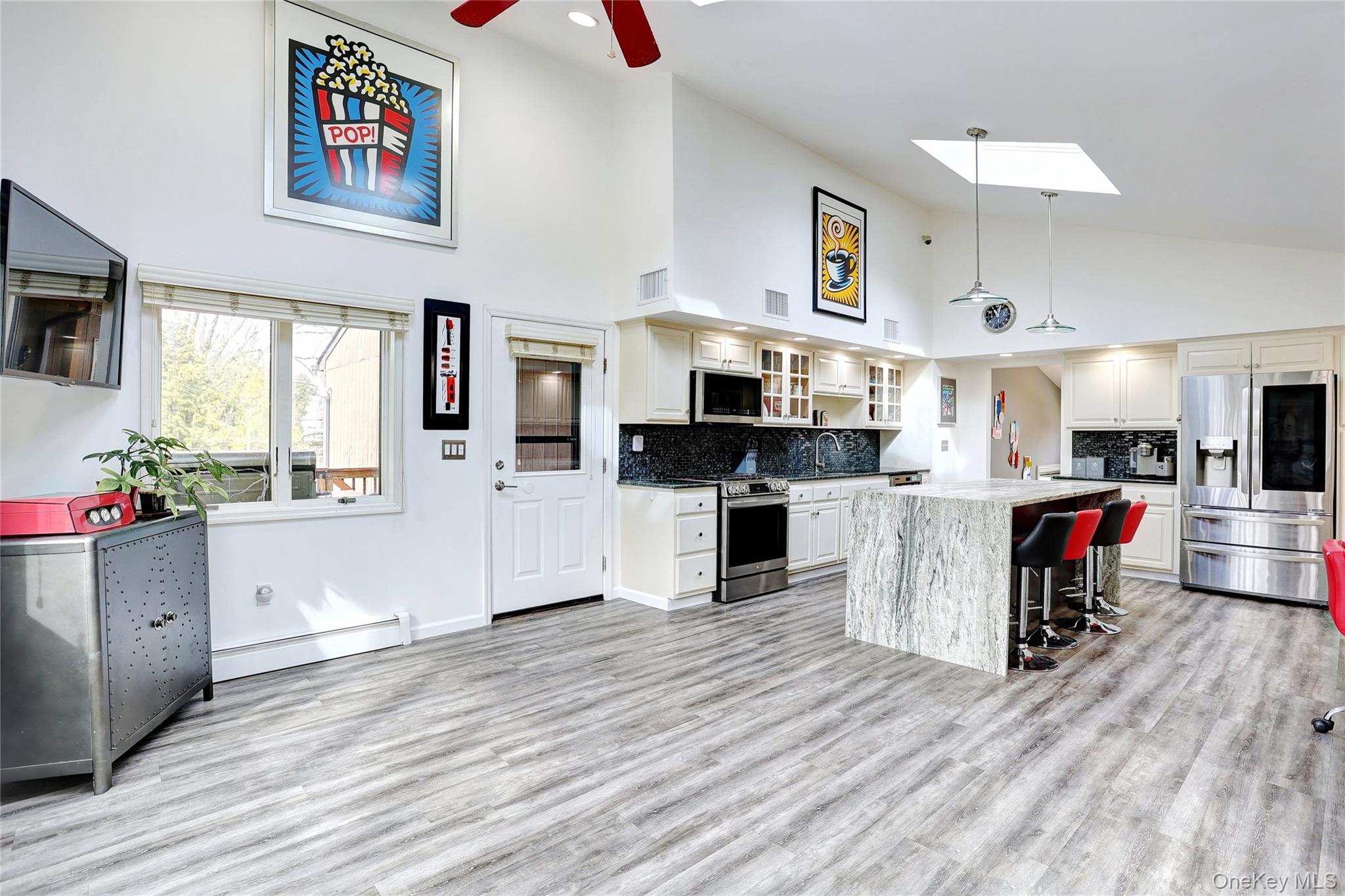 42 Cragmere Road Airmont, NY 10901 - Photo 11 of 32 a kitchen with stainless steel appliances granite countertop a refrigerator oven a stove top oven and a sink with cabinets