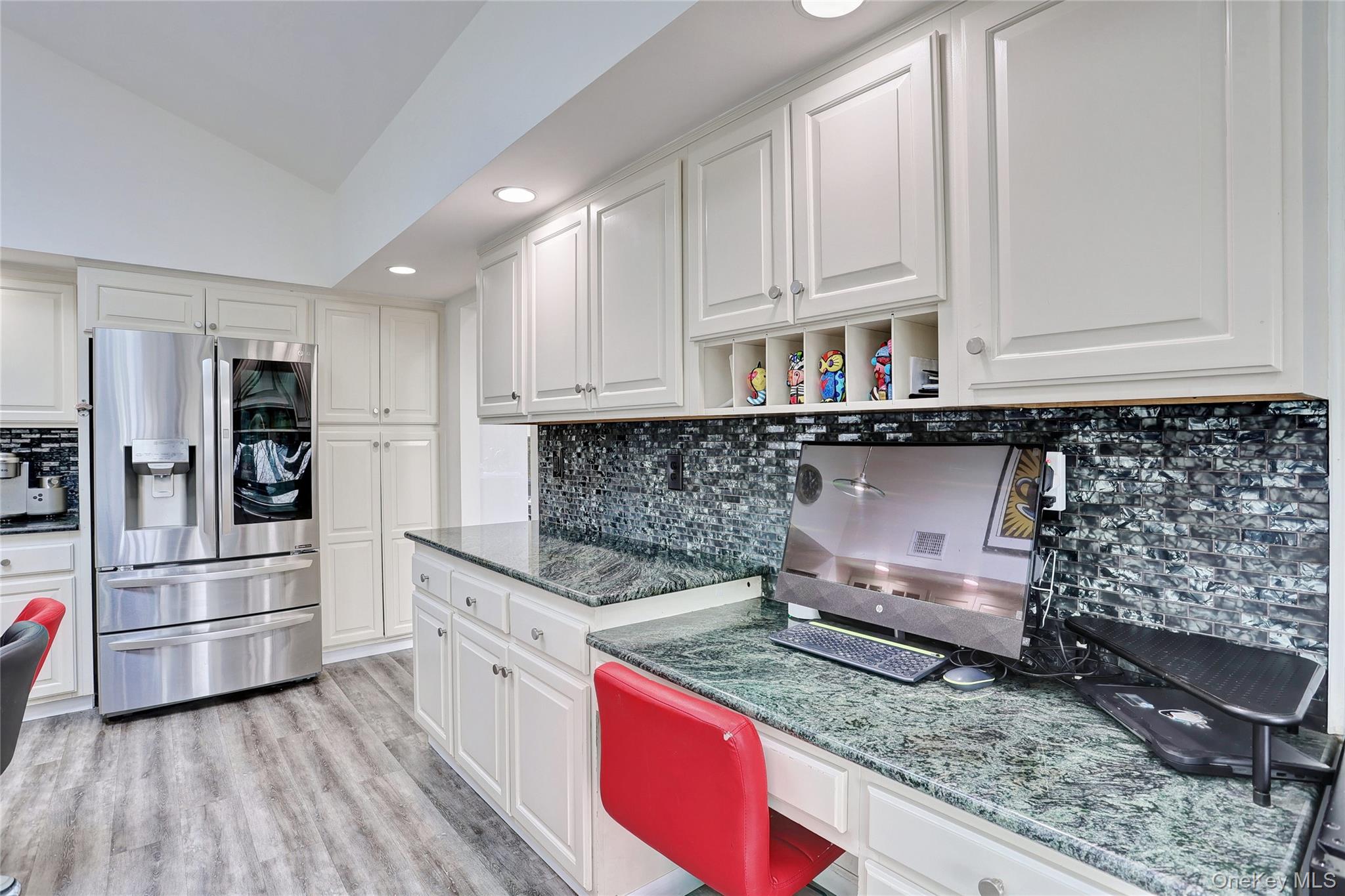 42 Cragmere Road Airmont, NY 10901 - Photo 12 of 32 a kitchen with stainless steel appliances granite countertop a stove a sink and a refrigerator