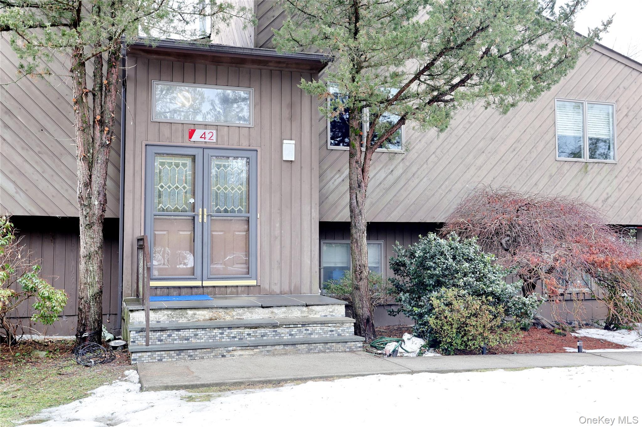 42 Cragmere Road Airmont, NY 10901 - Photo 2 of 32 a front view of a house with a garden