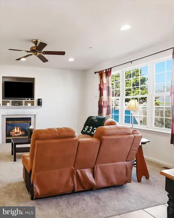 a bedroom with a bed and a television