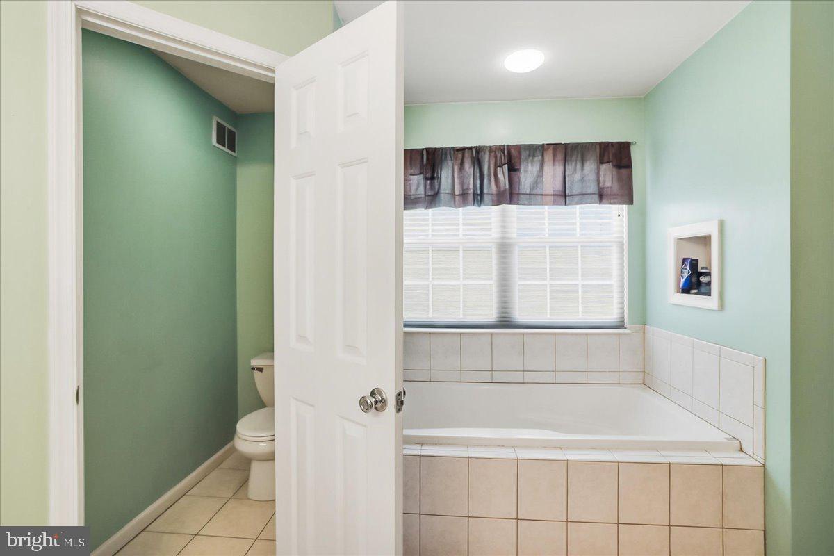 2431 Gilbert Street Broomall, PA 19008 - Photo 21 of 38 Primary bathroom soaking tub and private toilet