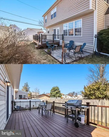 a view of a rooftop deck with chairs and table on the wooden floor