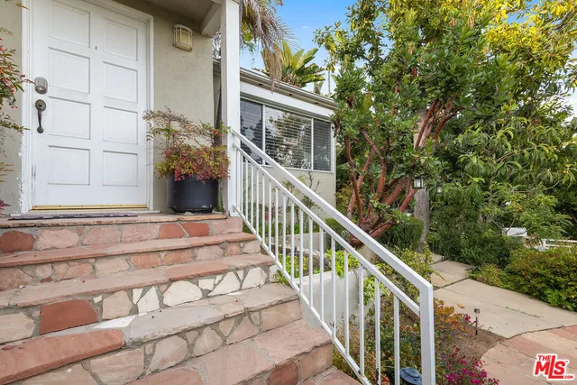 a view of balcony with wooden floor and fence