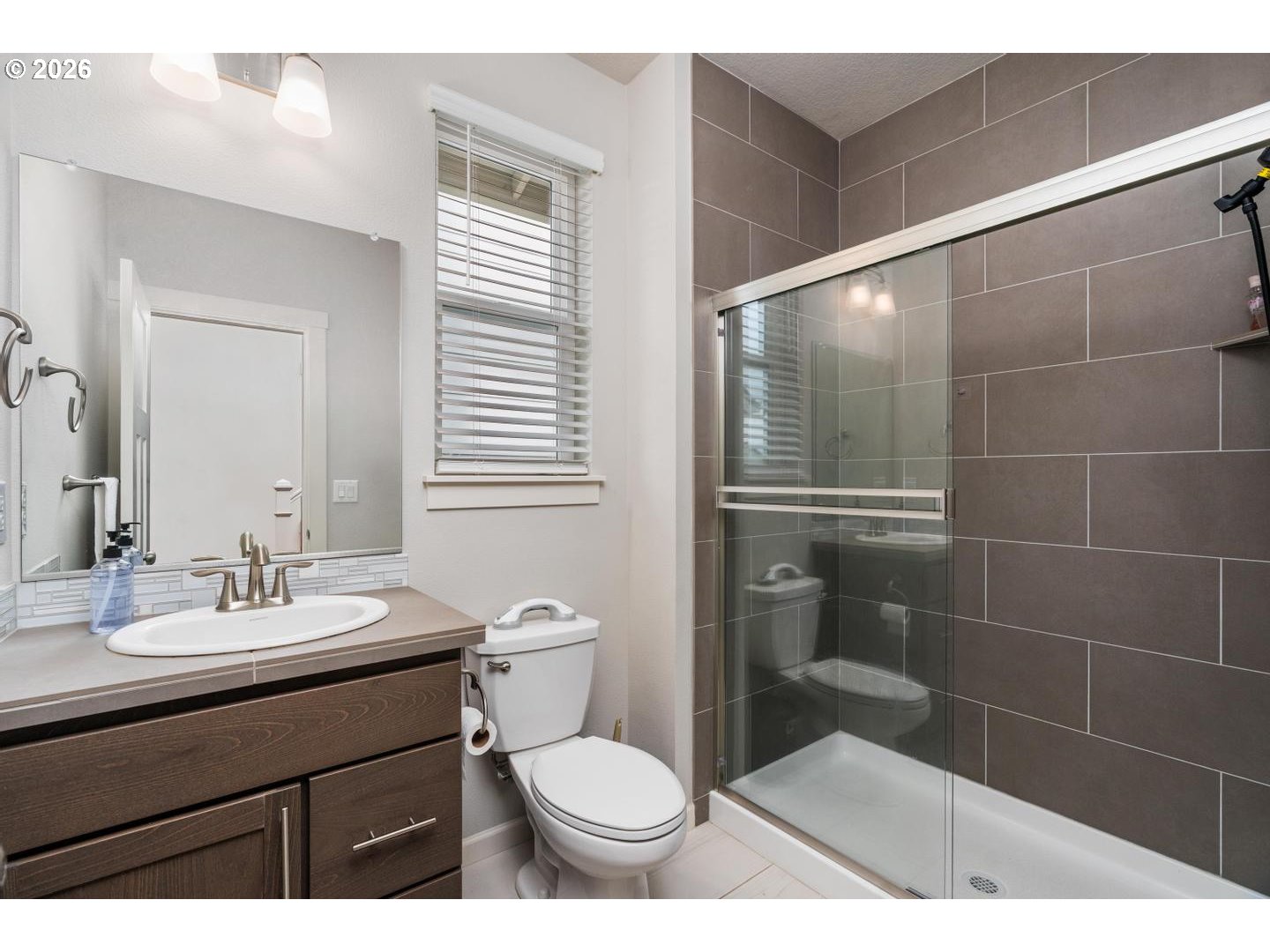 6301 North 89th Avenue Camas, WA 98607 - Photo 16 of 39 a bathroom with a sink toilet and shower