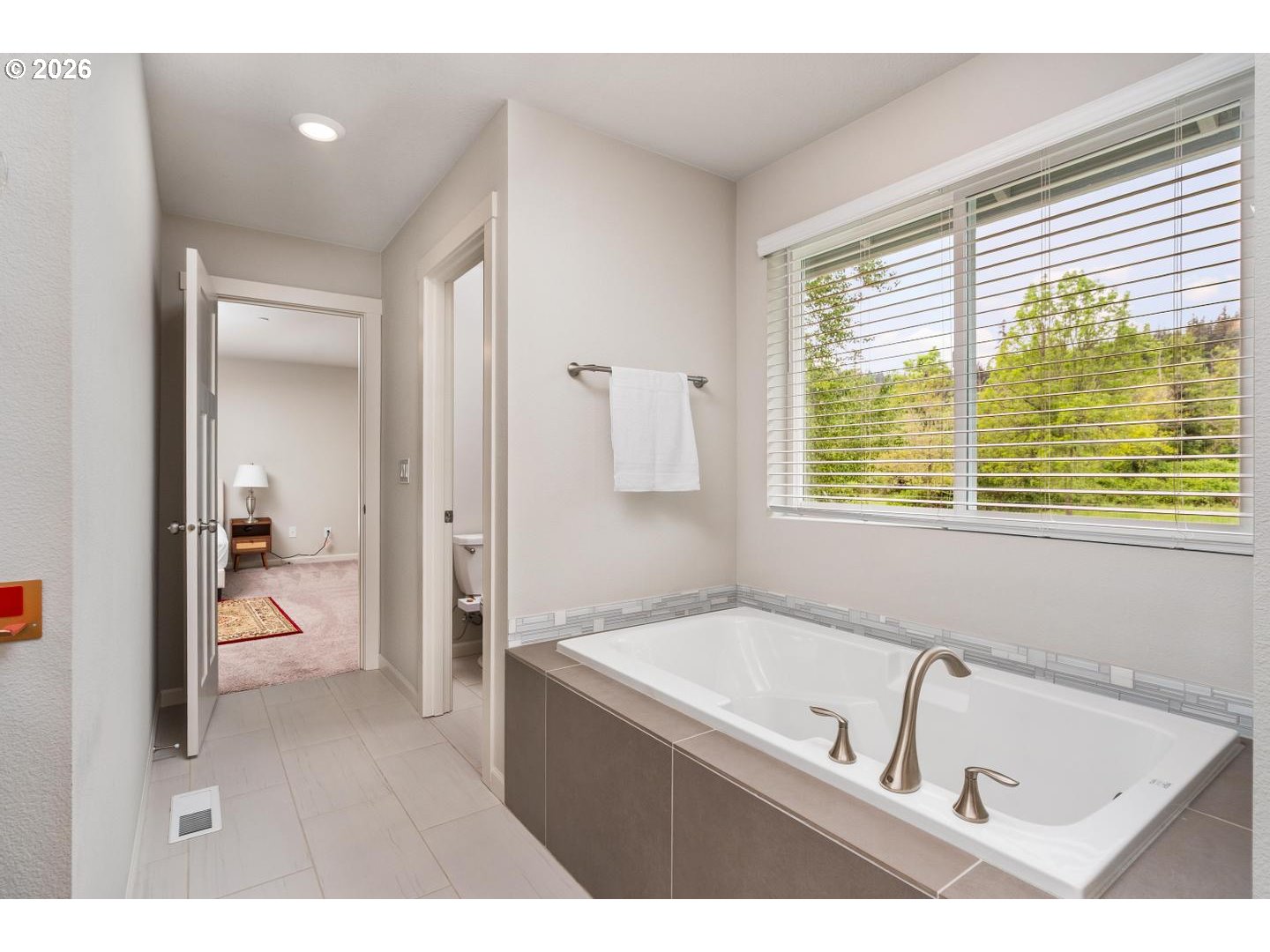 6301 North 89th Avenue Camas, WA 98607 - Photo 22 of 39 a bathroom with a tub a sink and a window
