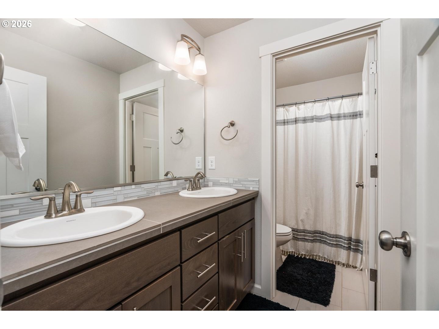 6301 North 89th Avenue Camas, WA 98607 - Photo 25 of 39 a bathroom with a sink and a mirror