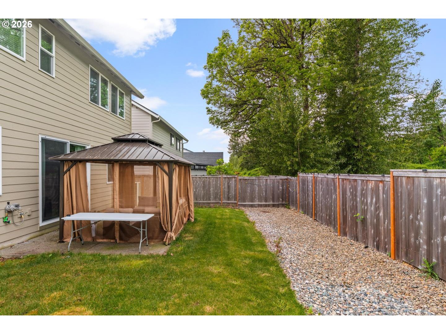 6301 North 89th Avenue Camas, WA 98607 - Photo 27 of 39 a backyard of a house with table and chairs
