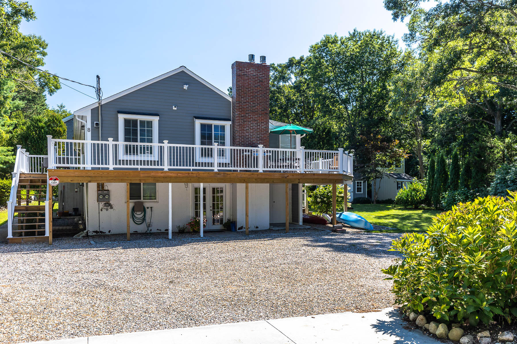 8 Cutlass Lane Mashpee, MA 02649 - Photo 14 of 30 a front view of a house with a garden