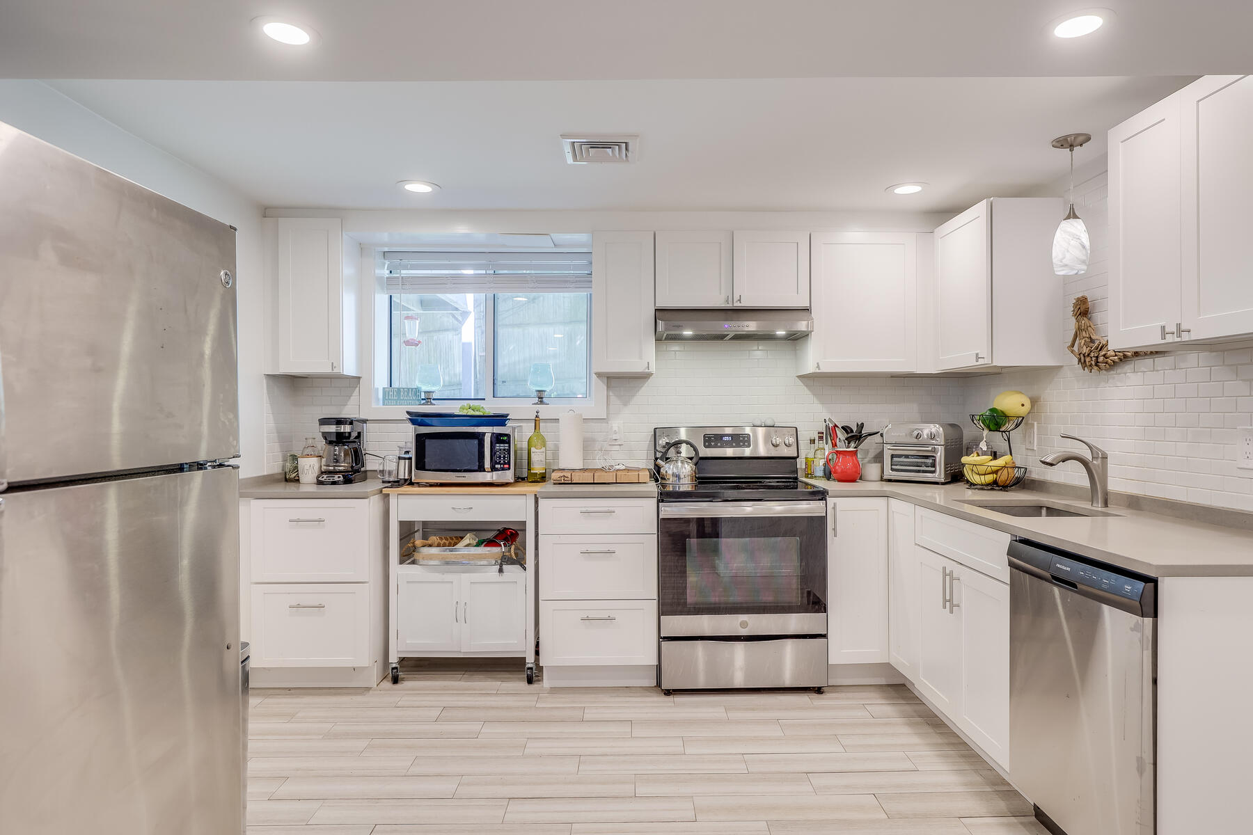 8 Cutlass Lane Mashpee, MA 02649 - Photo 20 of 30 a kitchen with a white cabinets and white appliances